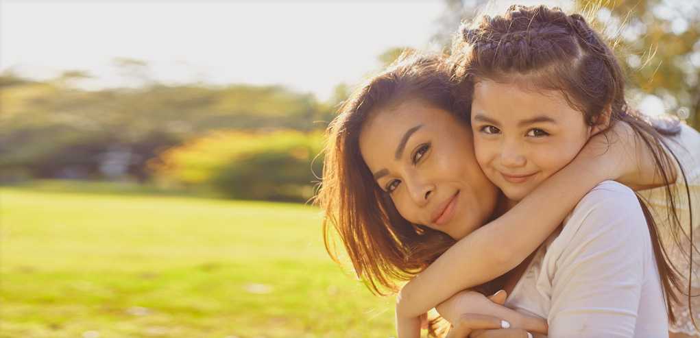 Mother and Daughter Enjoying the Outdoors After an Eczema Treatment.